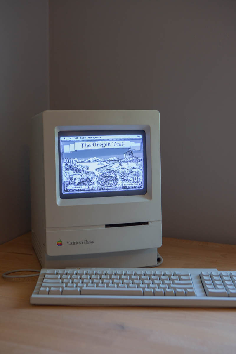 The restored Mac Classic powered on, showing the Oregon Trail title screen